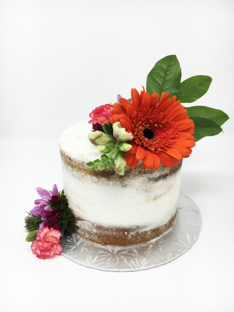 Rustic buttercream cake with floral decoration from a local vendor