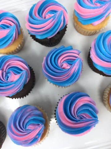Pink and blue swirled cupcakes for a gender reveal