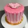 All pink chocolate drip themed cake