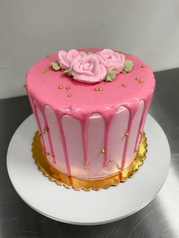 Baby girl themed cake with pink chocolate drip