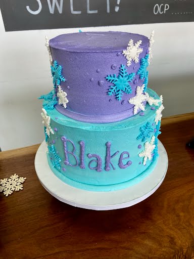 tiered baby shower themed cake for a winter wonderland