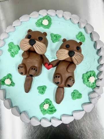Fondant otter themed cakes