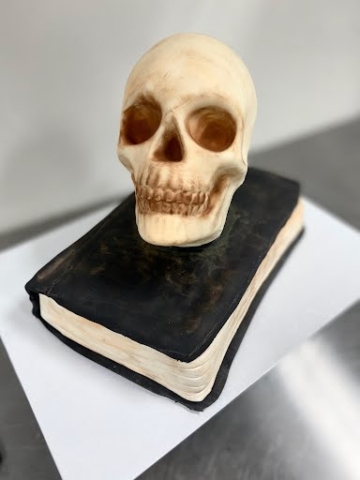 Halloween fondant book and skull themed cake