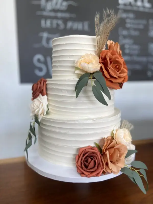 3-Tiered rustic line themed cake with artificial flowers