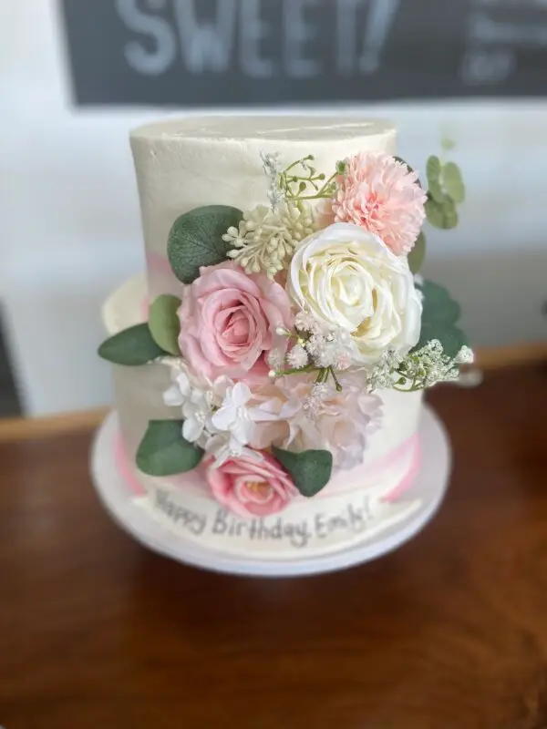 Pink and white tiered birthday cake