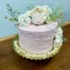8" Rustic spackle with light pink icing and ivory artificial flowers