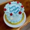 6" Smooth circle with light blue icing and cherries