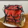 Heart lambeth 2-color with red and black icing, white pearls, and black ribbon