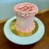 4" Smooth circle with light red icing and edible glitter