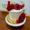 6" Rustic line with white icing and red artificial flowers