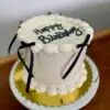 6" Smooth circle with which icing and black ribbons