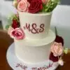 6"/9" textured with hand written monogram and artificial flowers