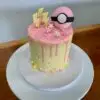 4" Pokemon theme with chocolate drip, edible gold splatter, sprinkles and fondant toppers