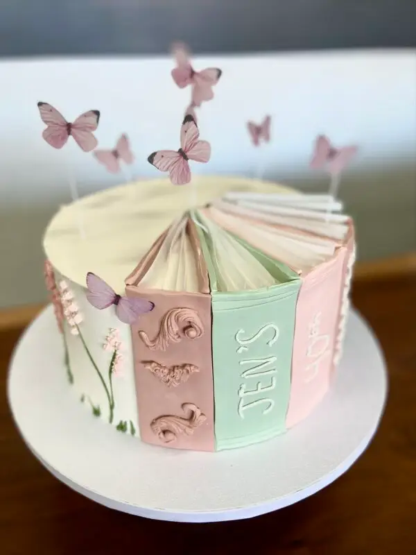 9" Book spine theme with icing floral design, paper toppers and fondant spine decorations