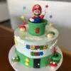 8" Super Mario theme with fondant details on side/topper, custom edible image name message, and plastic character topper