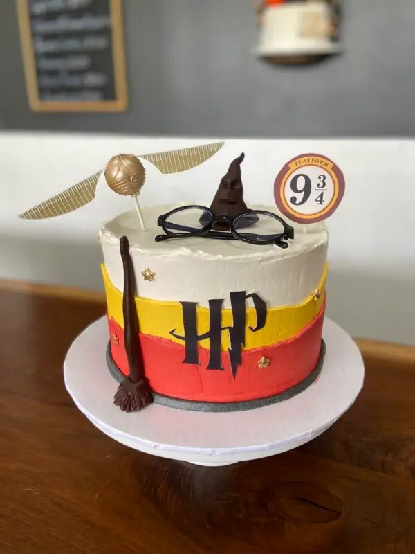 8" HP theme with fondant details, edible image logo, plastic glasses / toppers and paper topper