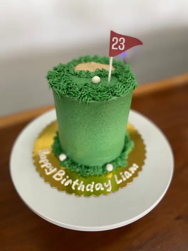 4" All icing golf theme with fondant balls and paper flag topper