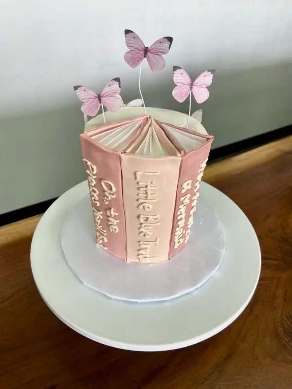 4" Book spine theme with paper toppers and fondant spine details