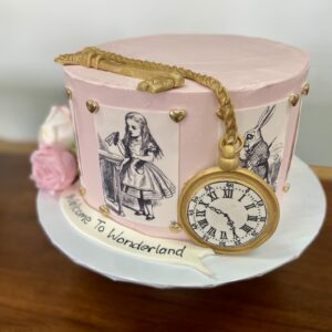 8" Alice in wonderland them with edible images, fondant decorations and artificial flowers and fondant banner