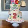 6"/8" with fondant details, edible image and plastic character toppers