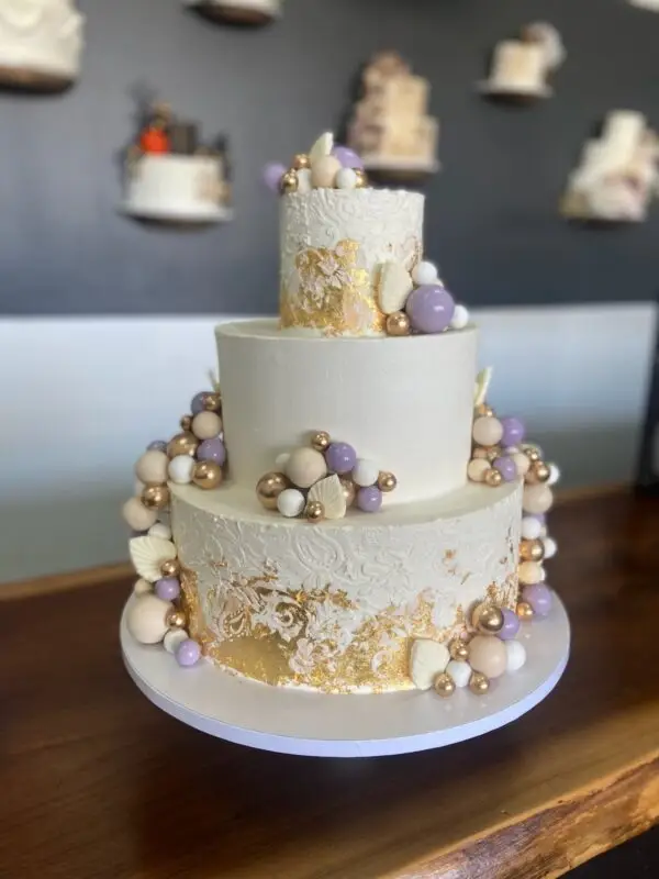 4"/8"/12" textured design with edible gold leaf, chocolates and plastic decorations